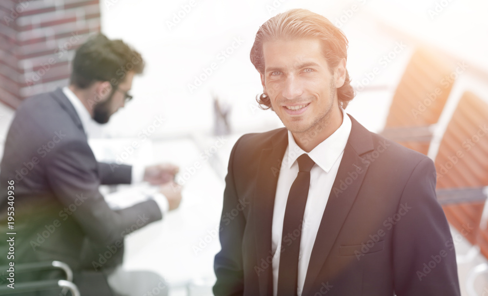 businessman standing in his office businessman standing in his office