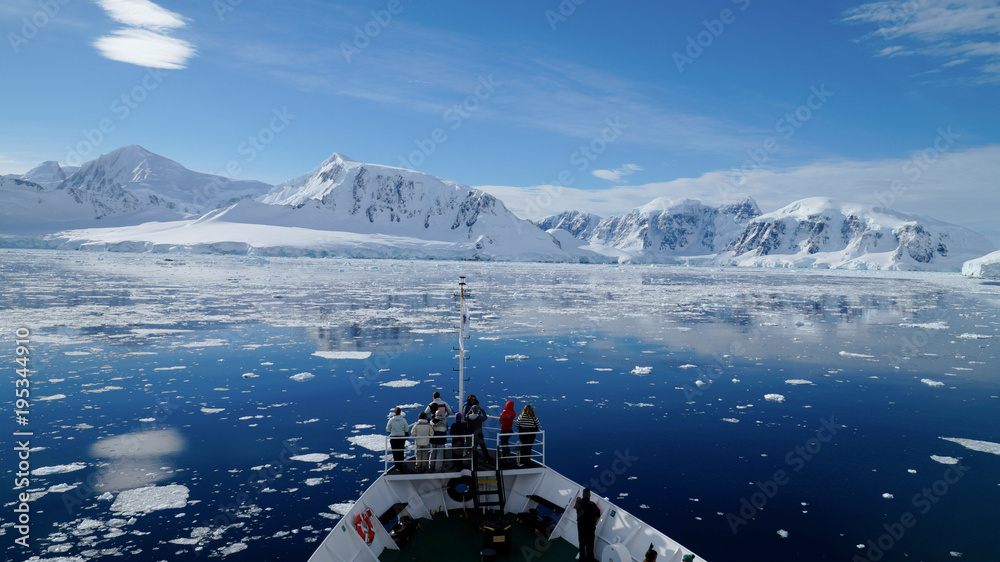 Cruising through the Neumayer channel full of Icebergs in Antarctica. - obrazy, fototapety, plakaty 