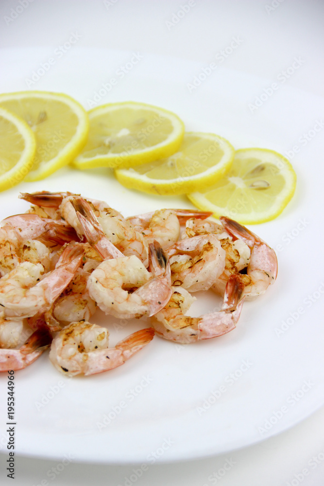 seafood. shrimp on a plate with lemon. seafood. shrimp on a plate with lemon.