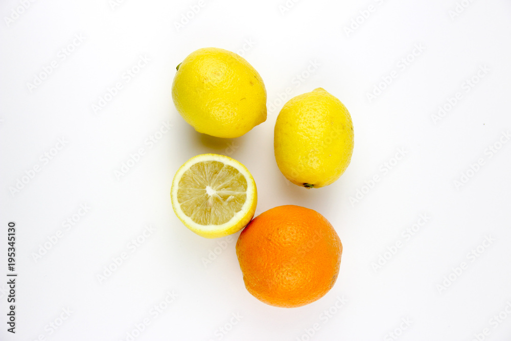 fresh fruits. Lemons and oranges sliced and whole