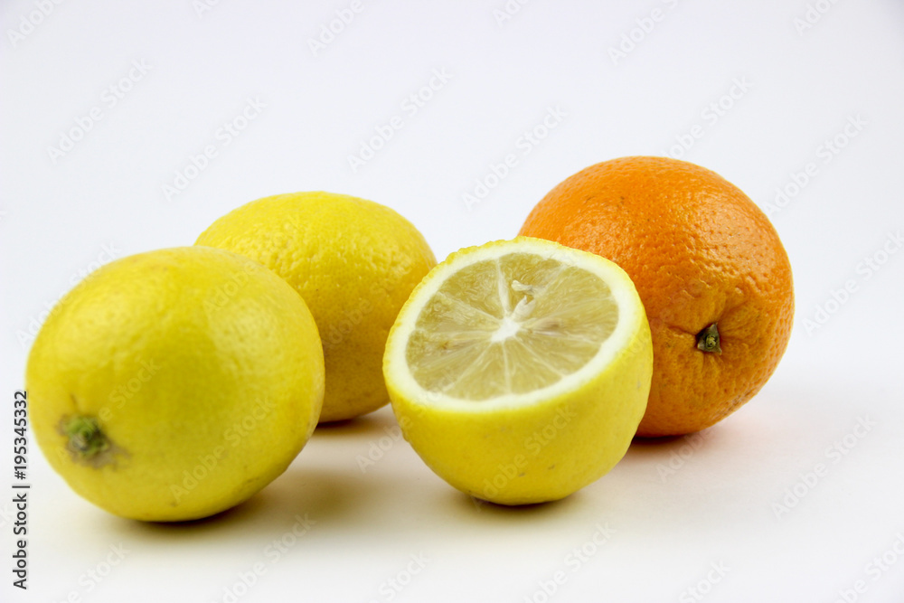 fresh fruits. Lemons and oranges sliced and whole