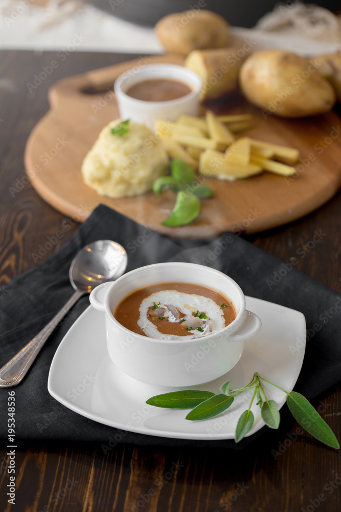 Vegetable cream soup with shrimps and croutons in white bowl close up Vegetable cream soup with shrimps and croutons in white bowl close up
