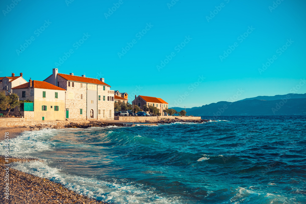 Panoramic view on a beautiful beach of a small Croatian town Postira - Croatia, island Brac
