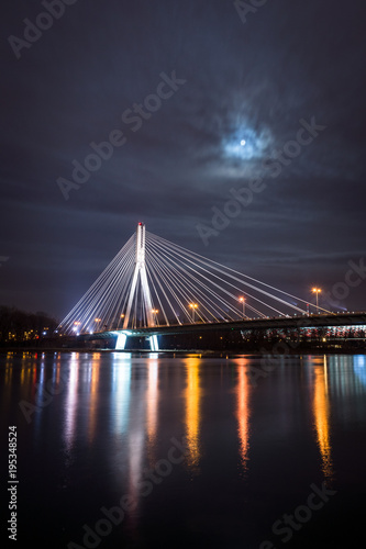 Swietokrzyski bridge over the Vistula river at night in Warsaw, Poland