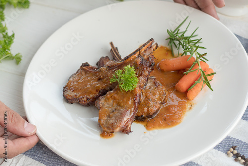 Rack of Lamb with Grilled Peach on white dish