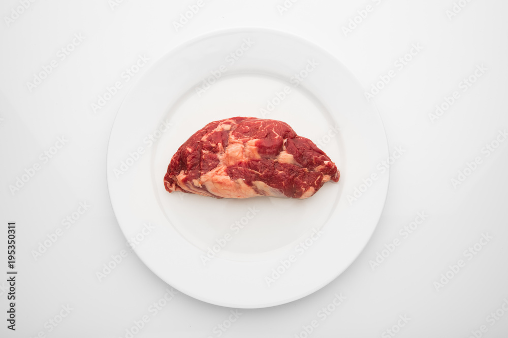 fresh beef meat on white plate fresh beef meat on white plate