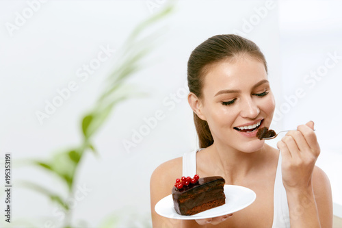 Woman Eating Cake. Beautiful Female Eating Dessert