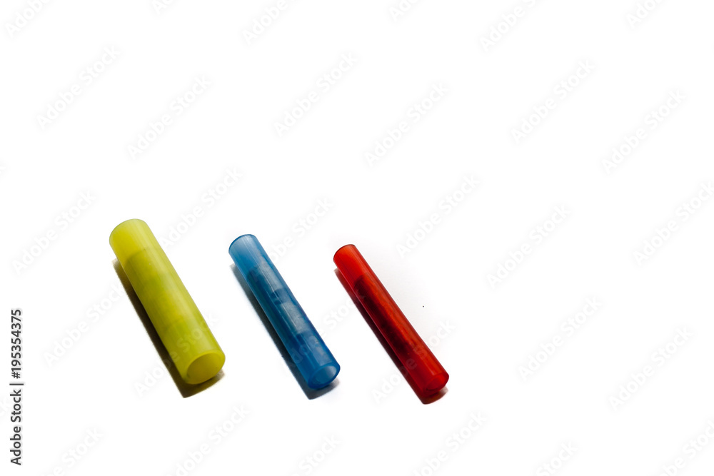 Electrical blue, red and yellow wire connector nylon, 2 way Splice wire connector on white background. Electrical blue, red and yellow wire connector nylon, 2 way Splice wire connector on white background.