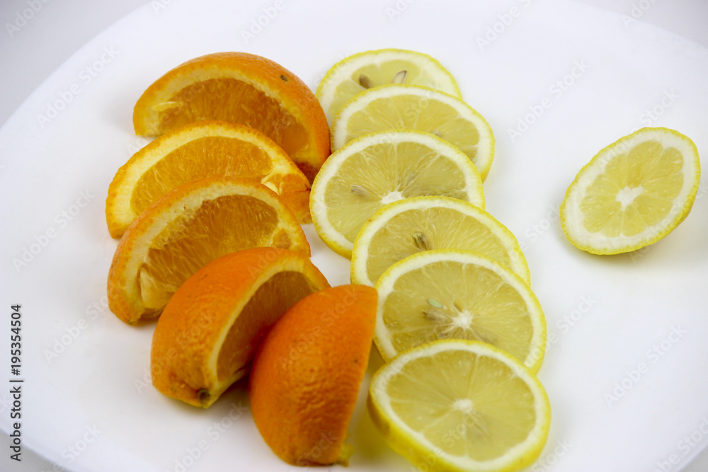 fresh fruits. Lemons and oranges sliced and whole fresh fruits. Lemons and oranges sliced and whole