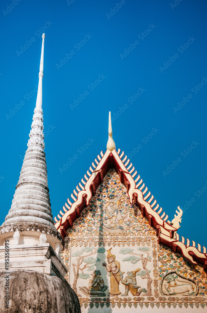 Fototapeta premium Wat Uposatharam Temple or Wat Bot at noon under clear blue sky, Thailand
