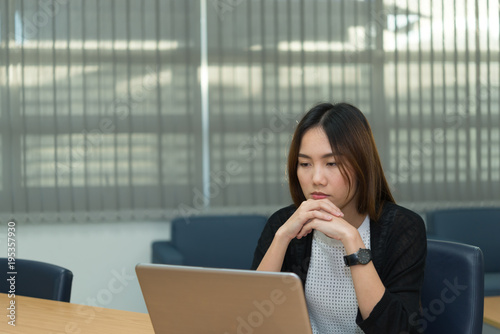 Asian businesswoman stress from hard work,Thai worker woman working in the office,Dark tone