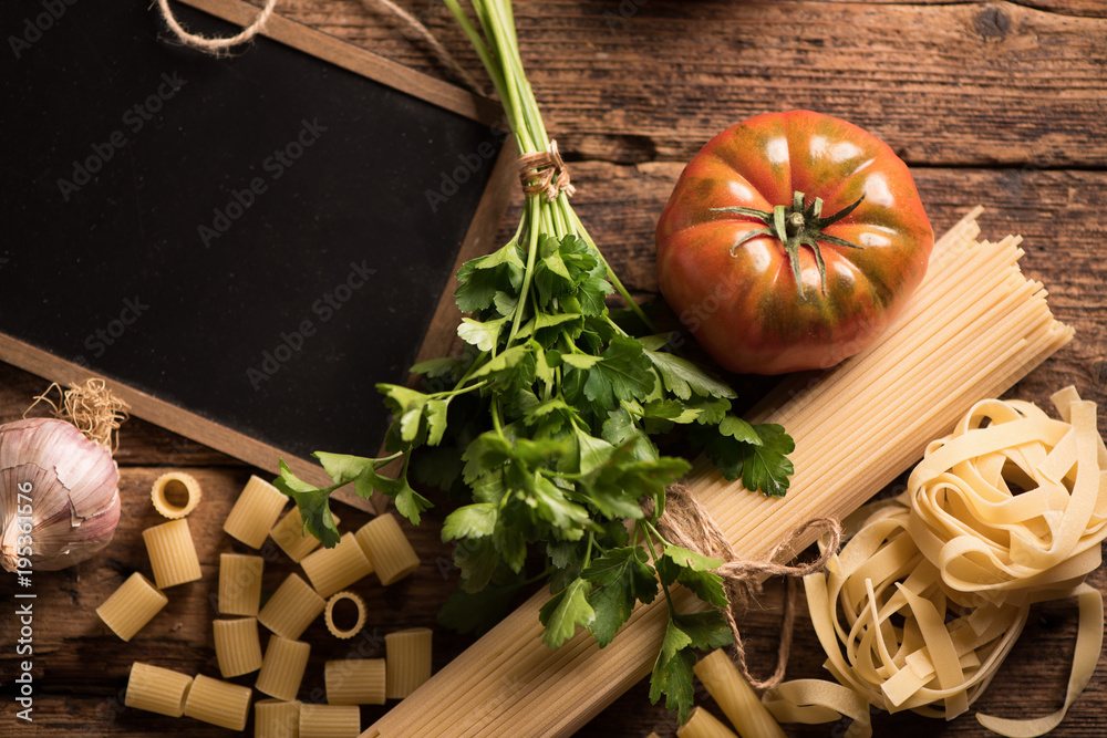 Italian food cooking ingredients. Pasta, vegetables. Top view with copy space