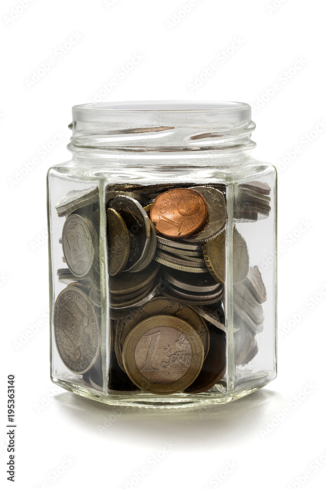 Coins in a glass jar on a white background Coins in a glass jar on a white background