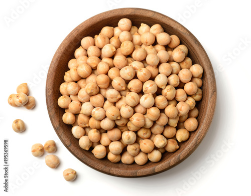 raw chickpea in the wooden plate, isolated on white, top view photo