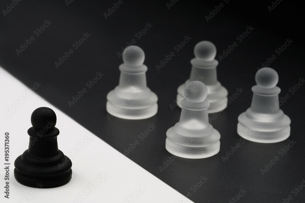 black figure against white figures. one against all. black versus white black figure against white figures. one against all. black versus white