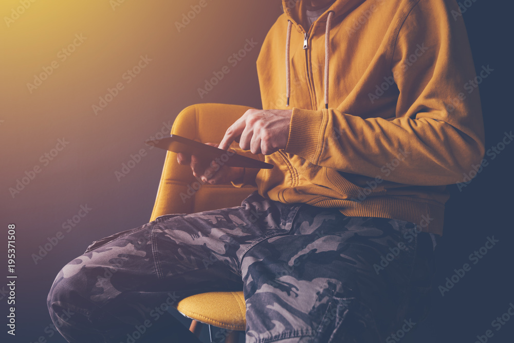 Casual man using digital tablet computer