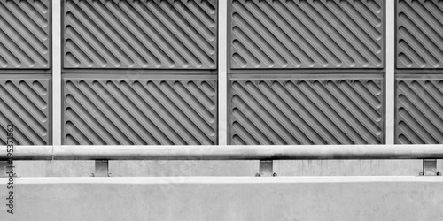 noise barrier wall on a highway - monochrome