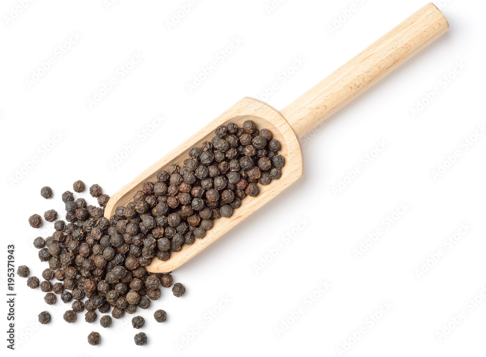 whole black peppercorns in the wooden scoop, isolated on white, top view whole black peppercorns in the wooden scoop, isolated on white, top view