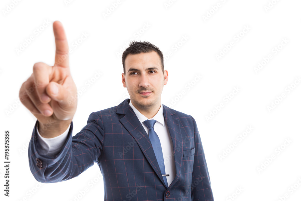 Modern businessman touching invisible screen or display. Modern businessman touching invisible screen or display.