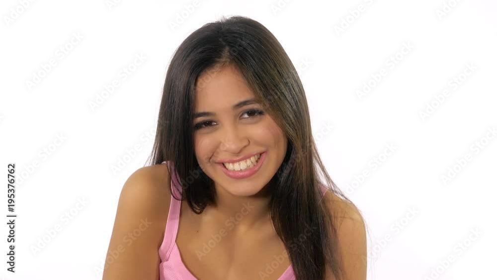 Happy cute hispanic female teenager smiling ok sign isolated slow motion Happy cute hispanic female teenager smiling ok sign isolated slow motion