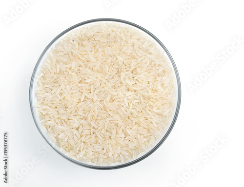 Healthy food. Parboiled rice in glass bowl isolated on white background. Top view. Copy space. High resolution product.
