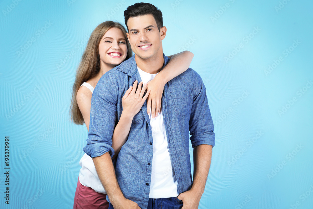 Happy young couple on light background Happy young couple on light background