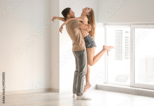 Young couple dancing in the...