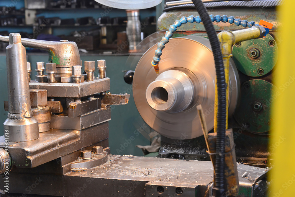 Machining on a lathe, processing of metal by cutting.