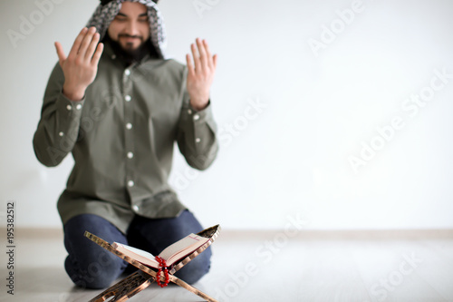 Young Muslim man praying, i...