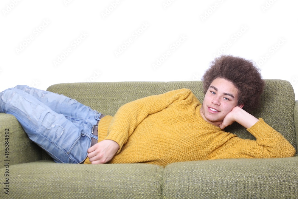 Young afro man on the couch Young afro man on the couch
