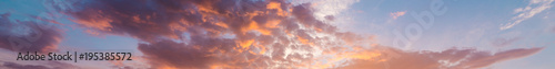 Fiery orange, pink and blue very beautiful sunset sky. Dramatic clouds after rain © LALSSTOCK