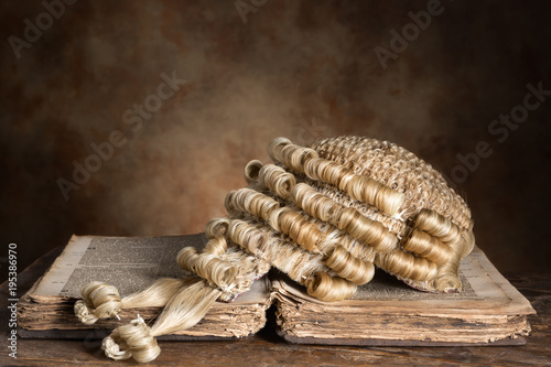Tablou pe pânză Barrister's wig on old book