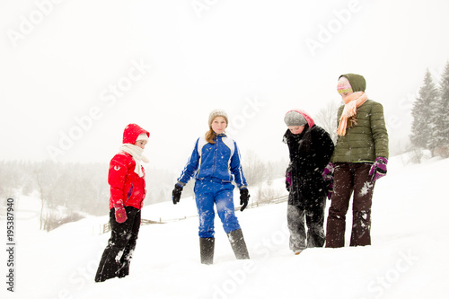 Group of happy children enjoying in winter