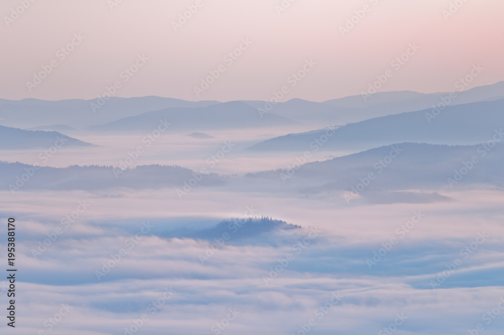 Summer mountain landscape with the sea fog