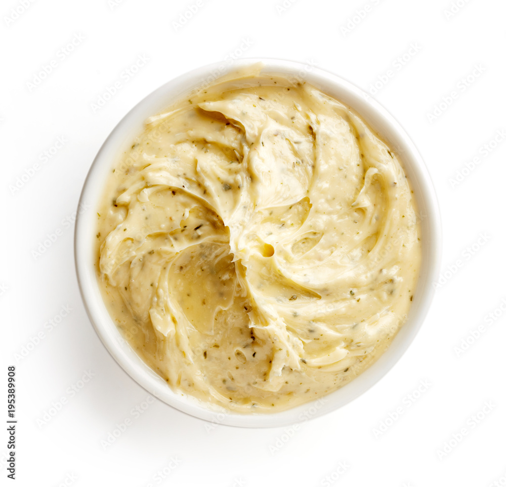 Bowl of herbal butter isolated on white, from above Bowl of herbal butter isolated on white, from above