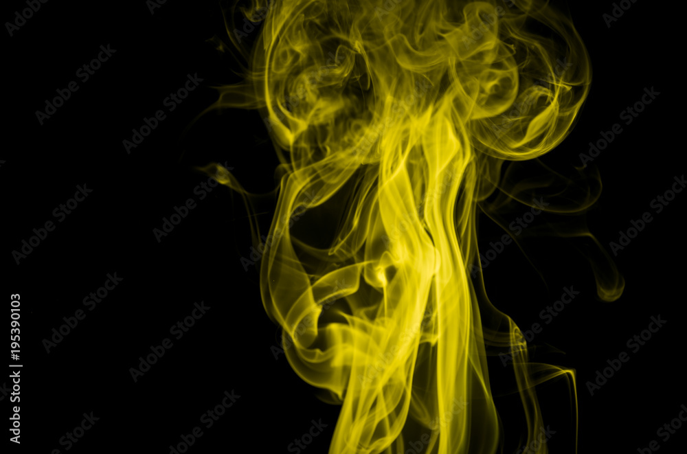 Yellow smoke on black background Yellow smoke on black background