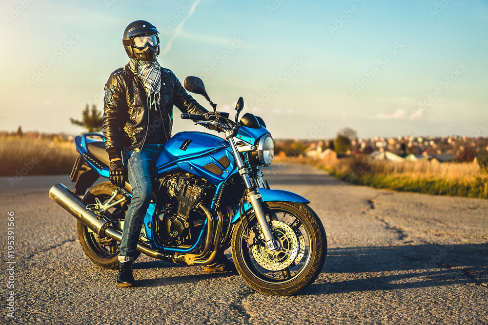 Man on sport motorcycle outdoor on the road Man on sport motorcycle outdoor on the road