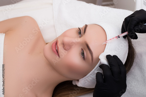 See after your skin! Attractive young girl getting a procedure o