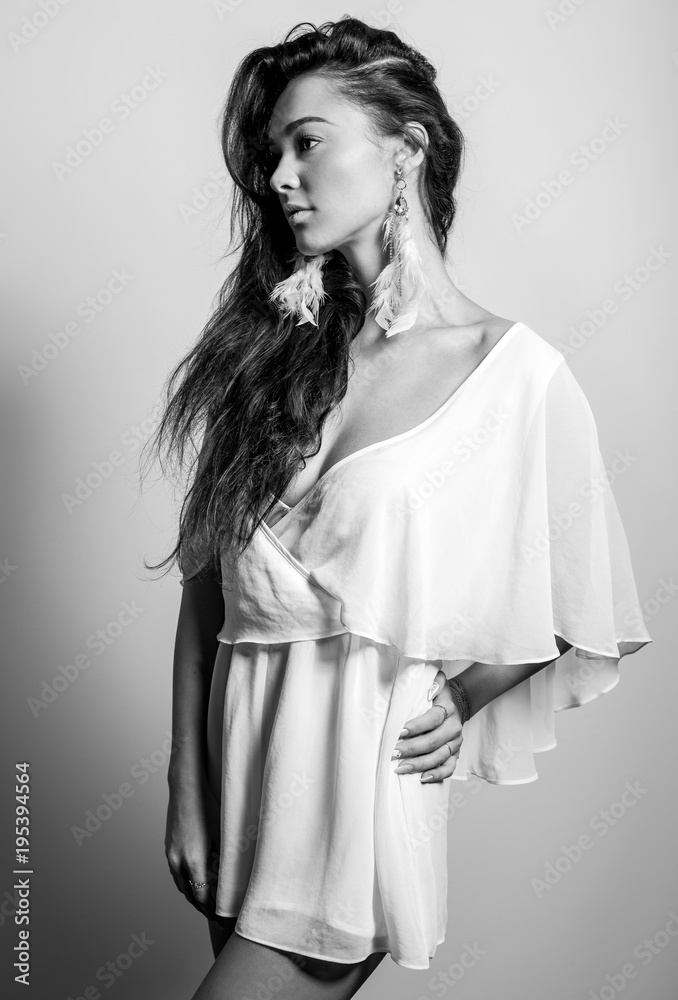 Young beautifull woman pose in studio. Black-white photo. Young beautifull woman pose in studio. Black-white photo.