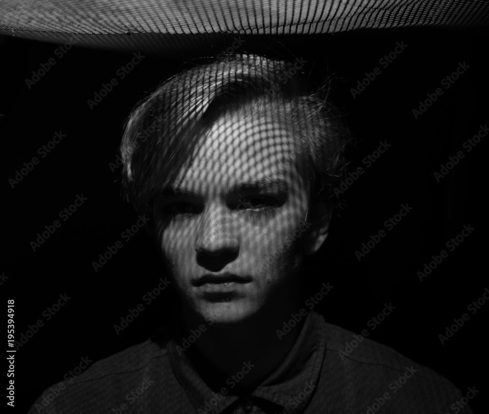 guy with a shadow from the lattice on his face guy with a shadow from the lattice on his face