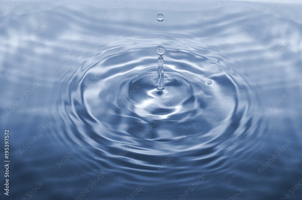 Water drop falling making droplet splash and waves clean and fresh concept Water drop falling making droplet splash and waves clean and fresh concept