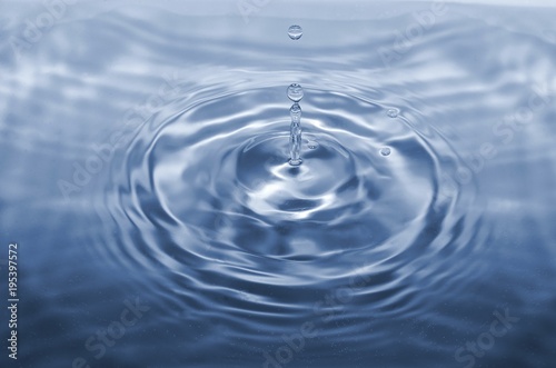 Water drop falling making droplet splash and waves clean and fresh concept