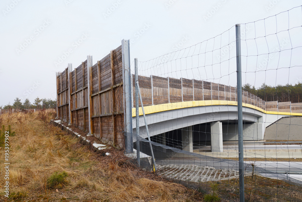 A safe crossing for wild animals above the freeway A safe crossing for wild animals above the freeway
