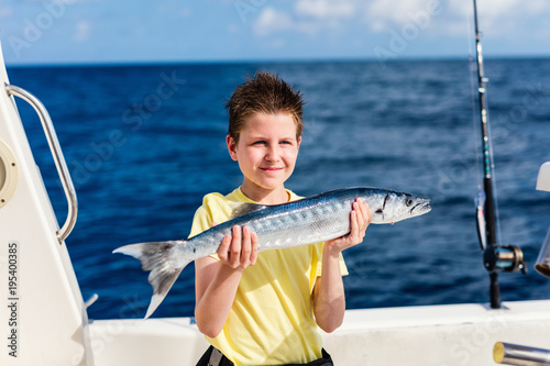 Boy deep sea fishing