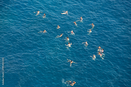 people swimming in sea © yanlev