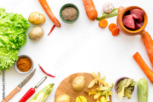 ingredients for vegetable ragout cooking on white table background top view mock-up