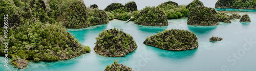 Painemo Islands panoramic shot, Blue Lagoon, Raja Ampat, West Papua, Indonesia photo