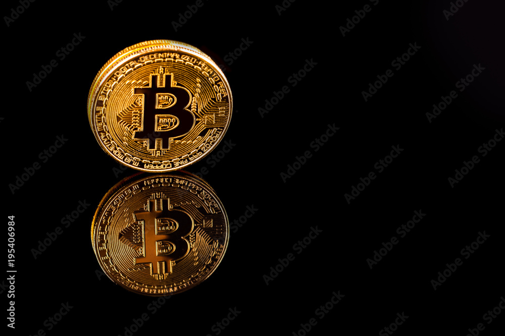 Gold Bitcoin on background of black isolate. Gold Bitcoin on background of black isolate.