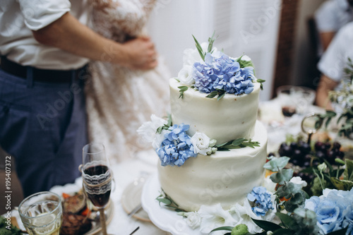 Fototapeta Naklejka Na Ścianę i Meble -  blue and white tiered wedding cake