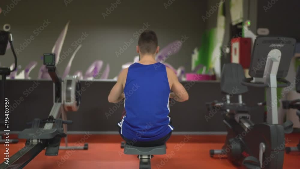 Man at a rowing machine Man at a rowing machine